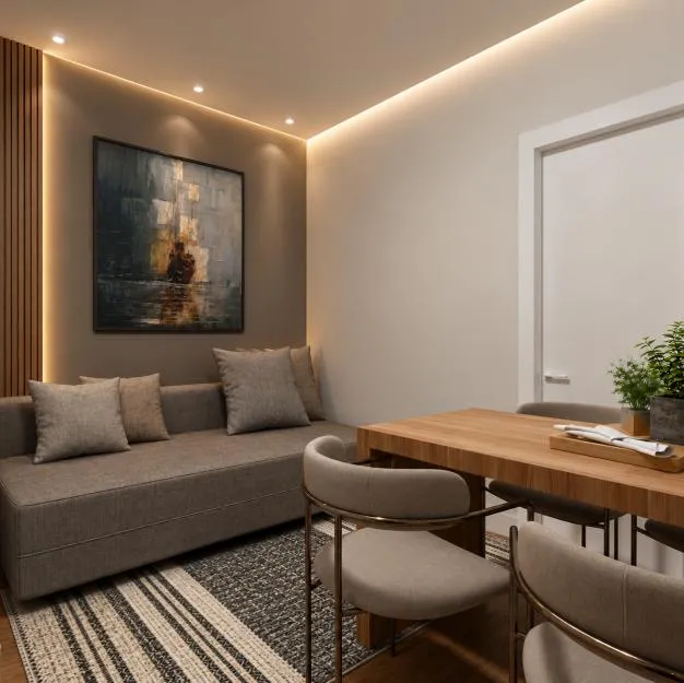 Estar do studio com sofá e mesa de trabalho